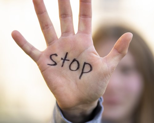 defocused-person-protesting-with-writing-hand-world-environment-day-outdoors